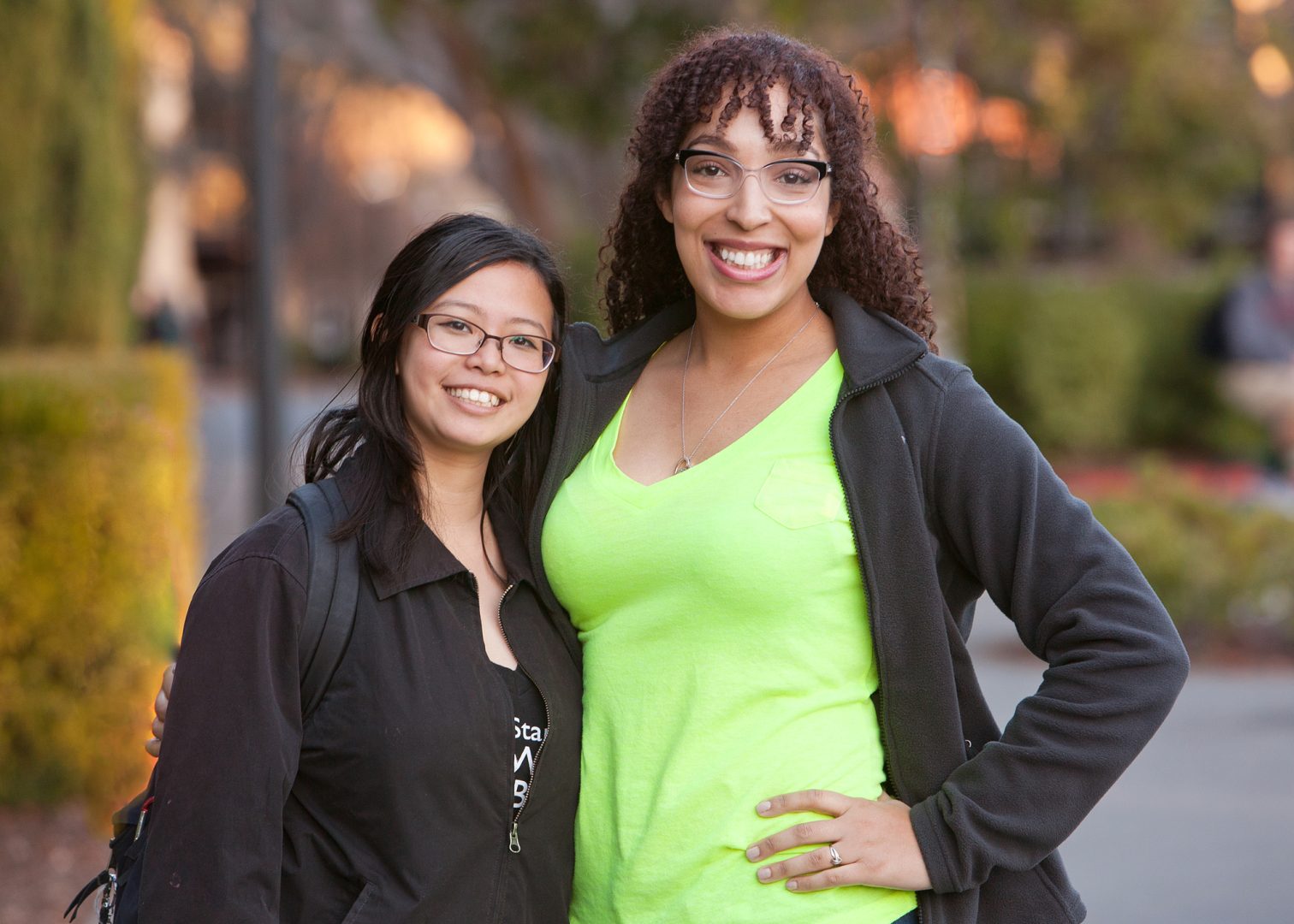 two women green shirt